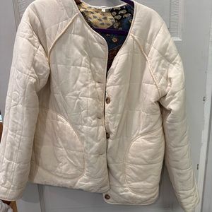 Reversible coat. Quilted pattern interior. Buttons outer and inner.